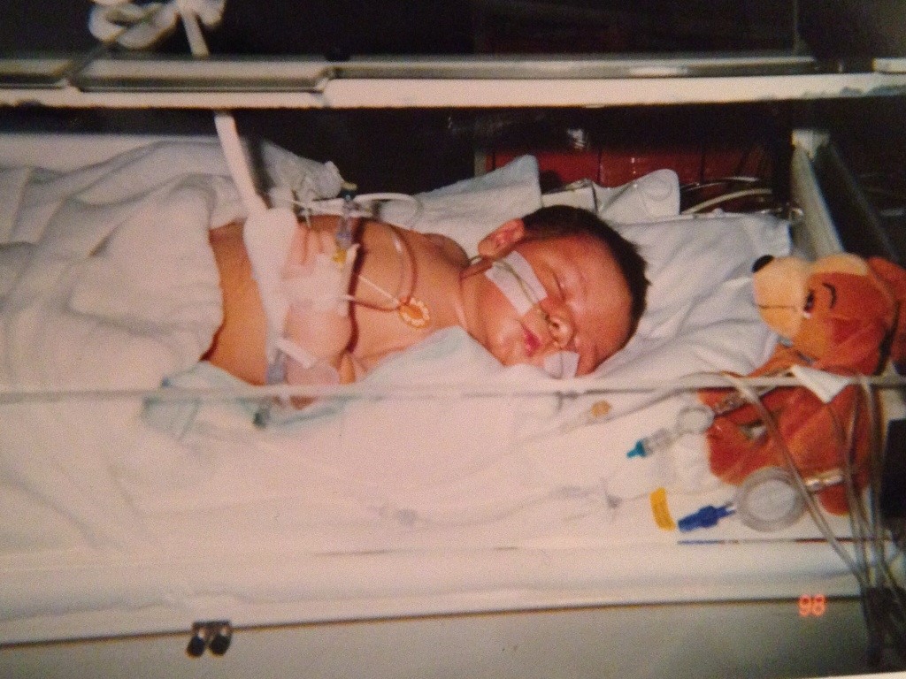 sam as a baby in an incubator